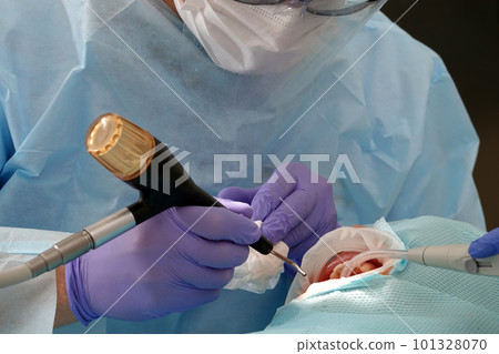 Kiev, Ukraine August 22, 2020: Dentist doctor works with a patient close-up Kiev, Ukraine August 22, 2020: Dentist doctor works with a patient close-up 101328070