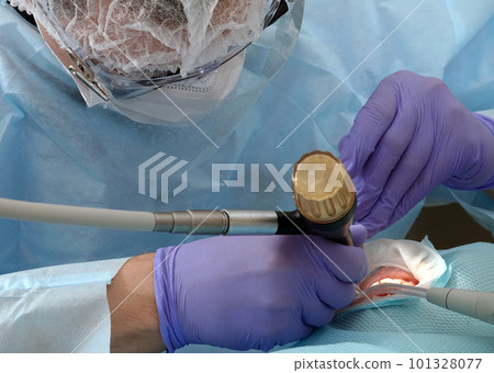 Kiev, Ukraine August 22, 2020: Dentist doctor works with a patient close-up Kiev, Ukraine August 22, 2020: Dentist doctor works with a patient close-up 101328077