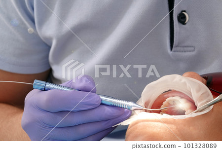 Kiev, Ukraine August 22, 2020: Dentist doctor works with a patient close-up Kiev, Ukraine August 22, 2020: Dentist doctor works with a patient close-up 101328089