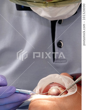 Kiev, Ukraine August 22, 2020: Dentist doctor works with a patient close-up Kiev, Ukraine August 22, 2020: Dentist doctor works with a patient close-up 101328090