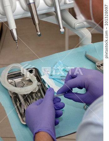 Kiev, Ukraine August 22, 2020: Dentist doctor works with a patient close-up Kiev, Ukraine August 22, 2020: Dentist doctor works with a patient close-up 101328097