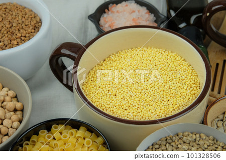 Millet in bowl. Shopping and storage products. Vegetarian organic product. 101328506