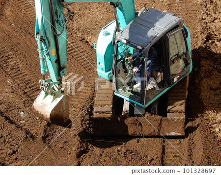 Planned construction site leveled with heavy machinery Planned construction site leveled with heavy machinery 101328697