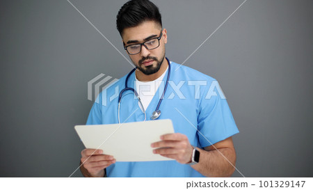 doctor doing paperwork checking medical documents at workplace. doctor doing paperwork checking medical documents at workplace. 101329147