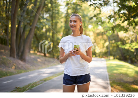 young fitness woman running in park 101329226