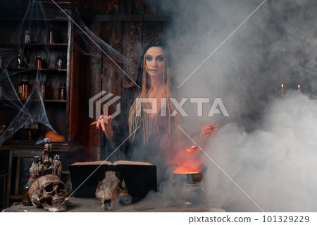 Halloween, witch use magic book and cauldron prepare poison or love potion Halloween, witch use magic book and cauldron prepare poison or love potion 101329229