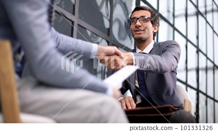 Shot of businessmen making a deal after viewing a document 101331326