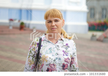 blonde young woman portrait outdoor. Sad 40s woman. Mental health. 40s years woman sad, serious, have problems and depression. Psychology concept. Out of focus 101331680
