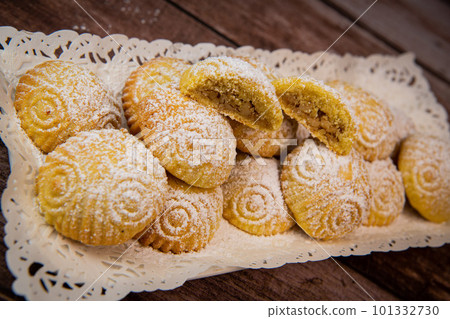 Traditional eid maamoul or mamoul cookies with dates, nuts, and jam, Arabic sweets for Aid al-Fitr Traditional eid maamoul or mamoul cookies with dates, nuts, and jam, Arabic sweets for Aid al-Fitr 101332730