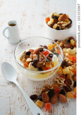 Yogurt with nuts and dried fruits, sprinkled with honey Yogurt with nuts and dried fruits, sprinkled with honey 101333067
