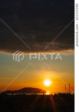 A sunset with a dark cloud in the sky A sunset with a dark cloud in the sky 101333390