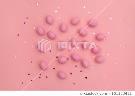 Happy Easter card. Bright pink chocolate eggs lie on pastel pink background. Shimmering glowing hearts. Minimalist composition. Use in marketing materials, decorative element in variety of contexts Happy Easter card. Bright pink chocolate eggs lie on pastel pink background. Shimmering glowing hearts. Minimalist composition. Use in marketing materials, decorative element in variety of contexts 101333431