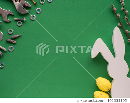 Easter background with hand tools, fasteners, fittings, eggs and white rabbit Easter background with hand tools, fasteners, fittings, eggs and white rabbit 101335195