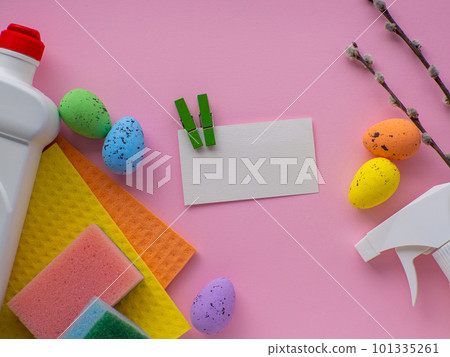 Detergent with Easter decoration on pink background with copy space 101335261
