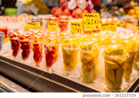Assortment of fresh cut fruit in plastic containers in market grocery display case, Barcelona, Spain Assortment of fresh cut fruit in plastic containers in market grocery display case, Barcelona, Spain 101337559
