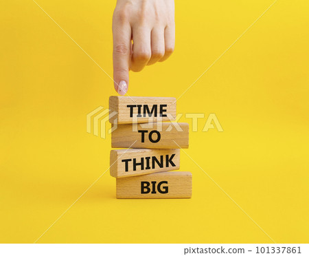 Time to think big symbol. Wooden blocks with words Time to think big. Beautiful yellow background. Businessman hand. Business and Time to think big concept. Copy space. Time to think big symbol. Wooden blocks with words Time to think big. Beautiful yellow background. Businessman hand. Business and Time to think big concept. Copy space. 101337861