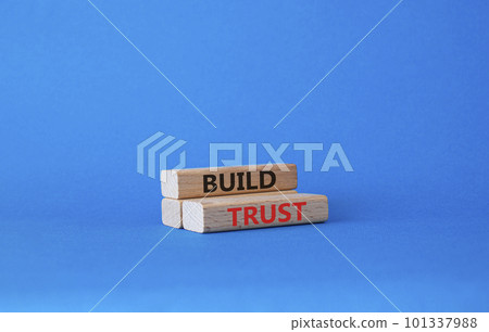 Build trust symbol. Wooden blocks with words Build trust. Beautiful blue background. Business and Build trust concept. Copy space. 101337988
