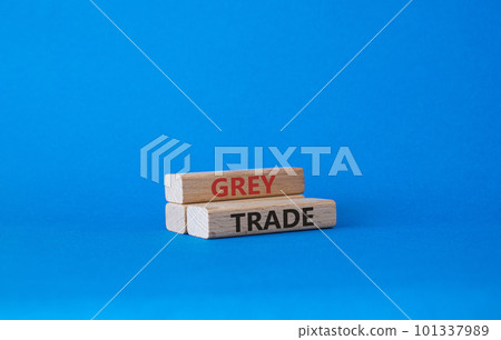 Grey trade symbol. Wooden blocks with words grey trade. Beautiful blue background. Business and grey trade concept. Copy space. 101337989