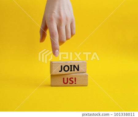 Join us symbol. Concept word Join us on wooden blocks. Beautiful yellow background. Businessman hand. Business and Join us concept. Copy space Join us symbol. Concept word Join us on wooden blocks. Beautiful yellow background. Businessman hand. Business and Join us concept. Copy space 101338011