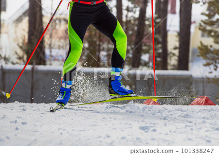 close-up legs skier athlete run on ski track 101338247
