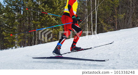 male athlete skier running skiing uphill cross country skiing 101338248