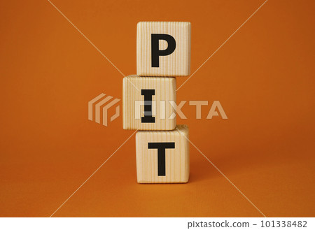 PIT - Personal Income Tax symbol. Wooden cubes with words PIT. Beautiful orange background. Business and PIT concept. Copy space. 101338482