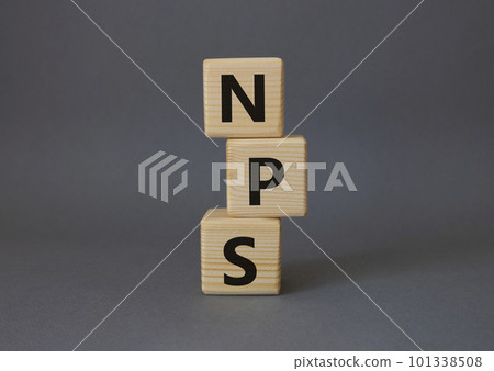 NPS - Net Promoter Score symbol. Wooden cubes with words NPS. Beautiful grey background. Business and NPS concept. Copy space. 101338508