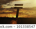 Tenge money sign at sunset in the rays of the setting sun. Sunset currency. Devaluation of money. 101338547