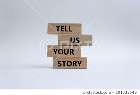 Tell us your story symbol. Concept words Tell us your story on wooden blocks. Beautiful white background. Business and Tell us your story concept. Copy space. 101338549