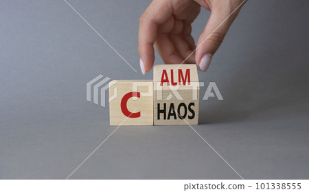 Calm vs chaos symbol. Businessman hand turns wooden cubes and changes word Chaos to Calm. Beautiful grey background. Business and Calm vs chaos concept. Copy space. Calm vs chaos symbol. Businessman hand turns wooden cubes and changes word Chaos to Calm. Beautiful grey background. Business and Calm vs chaos concept. Copy space. 101338555