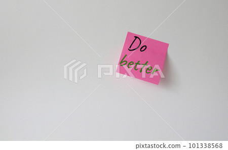 Do better symbol. Pink steaky note with concept words do better. Beautiful white background. Business and Do better concept. Copy space. Do better symbol. Pink steaky note with concept words do better. Beautiful white background. Business and Do better concept. Copy space. 101338568