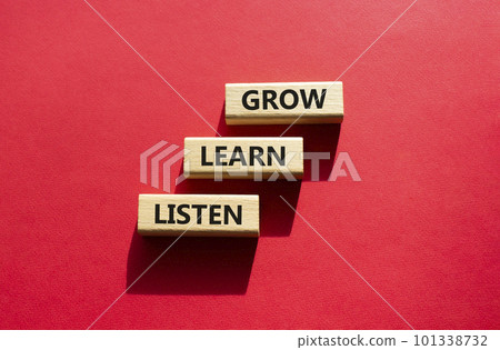 Grow Learn Listen symbol. Concept words Grow Learn Listen on wooden blocks. Beautiful red background. Business and Grow Learn Listen concept. Copy space 101338732