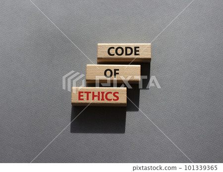 Code of ethics symbol. Concept words Code of ethics on wooden blocks. Beautiful grey background. Business and Code of ethics concept. Copy space. 101339365