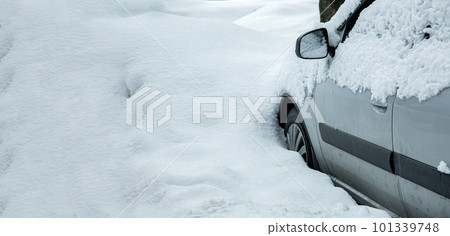 car covered with snow, dirty vehicle covered with snowy atmospheric precipitation on a winter day, nobody. car covered with snow, dirty vehicle covered with snowy atmospheric precipitation on a winter day, nobody. 101339748