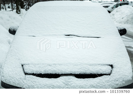 parked car in city parking blocked by snowfall, windshield with windshield wipers covered with snow, blocked lost car in snowy winter morning, nobody. parked car in city parking blocked by snowfall, windshield with windshield wipers covered with snow, blocked lost car in snowy winter morning, nobody. 101339760