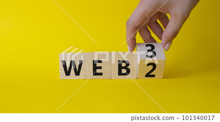 Web 3 vs Web 2 symbol. Businessman Hand turns cubes and changes the word web 2 to web 3. Beautiful yellow background. Business concept. Copy space Web 3 vs Web 2 symbol. Businessman Hand turns cubes and changes the word web 2 to web 3. Beautiful yellow background. Business concept. Copy space 101340017