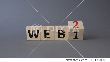 WEB 2 or 1 symbol. Turned wooden cubes with words WEB 1 and WEB 2. Beautiful grey background. Business and WEB concept. Copy space WEB 2 or 1 symbol. Turned wooden cubes with words WEB 1 and WEB 2. Beautiful grey background. Business and WEB concept. Copy space 101340019
