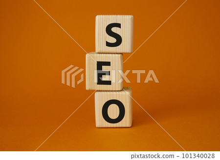 SEO - Search Engine Optimization symbol. Wooden blocks with words SEO. Beautiful orange background. Business and SEO concept. Copy space. SEO - Search Engine Optimization symbol. Wooden blocks with words SEO. Beautiful orange background. Business and SEO concept. Copy space. 101340028
