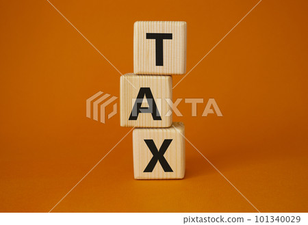 TAX - Shortness of breath symbol. Wooden cubes with words TAX. Beautiful orange background. Business and TAX concept. Copy space. TAX - Shortness of breath symbol. Wooden cubes with words TAX. Beautiful orange background. Business and TAX concept. Copy space. 101340029