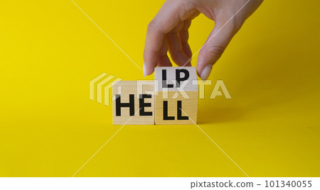 Help vs Hell symbol. Businessman hand Turnes cube and changes word Hell to Help. Beautiful yellow background. Psychology and Help vs Hell concept. Copy space Help vs Hell symbol. Businessman hand Turnes cube and changes word Hell to Help. Beautiful yellow background. Psychology and Help vs Hell concept. Copy space 101340055
