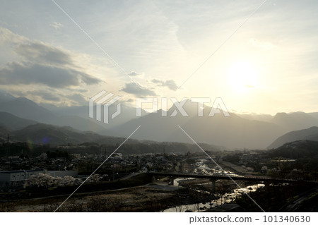 Takekawa-cho, Hokuto City, spring is in full bloom, the cityscape and the shining river line at dusk Takekawa-cho, Hokuto City, spring is in full bloom, the cityscape and the shining river line at dusk 101340630