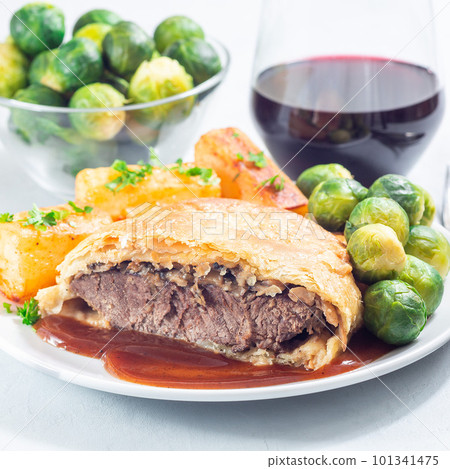 Beef Wellington with mushroom Duxelles, served with brussels sprouts and Chateau potato, square Beef Wellington with mushroom Duxelles, served with brussels sprouts and Chateau potato, square 101341475