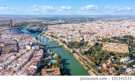 Aerial view of the Spanish city of Seville in the Andalusia region on river Guadaquivir overlooking cathedral and Real Alcazar 101341533