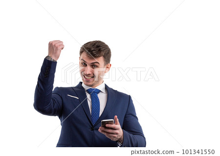 Young male businessman in a suit with a smartphone rejoices in winning lottery. Emotions are positive On white background 101341550