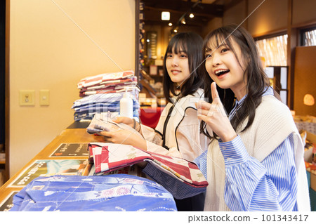 Woman choosing Yukata at spa 101343417