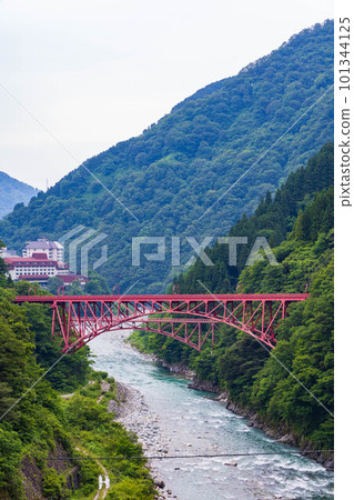 Shin-Yamabiko Bridge and Kyu-Yamabiko Bridge along the green Kurobe Gorge Railway Shin-Yamabiko Bridge and Kyu-Yamabiko Bridge along the green Kurobe Gorge Railway 101344125