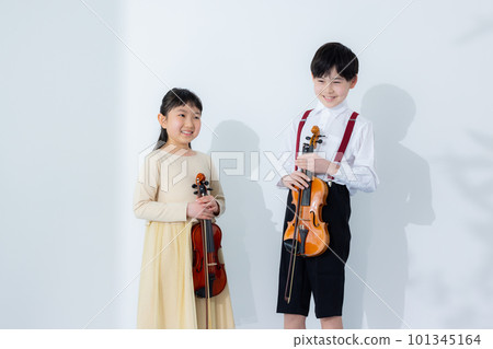 A child playing the violin A child playing the violin 101345164