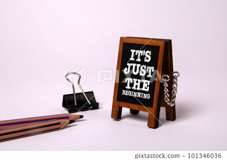 It's just the beginning. Miniature blackboard on a white background It's just the beginning. Miniature blackboard on a white background 101346036