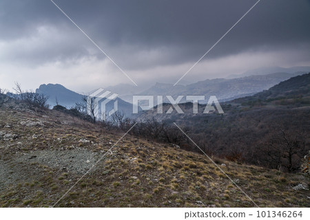 Landscape of Karadag Reserve in spring. View of mountains in fog and clouds. Crimea 101346264