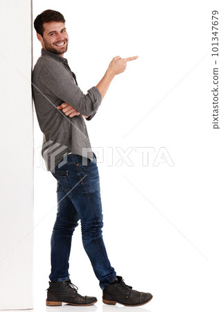 This is where its at. Full length studio shot of a smiling young man pointing at copyspace to the right. This is where its at. Full length studio shot of a smiling young man pointing at copyspace to the right. 101347679